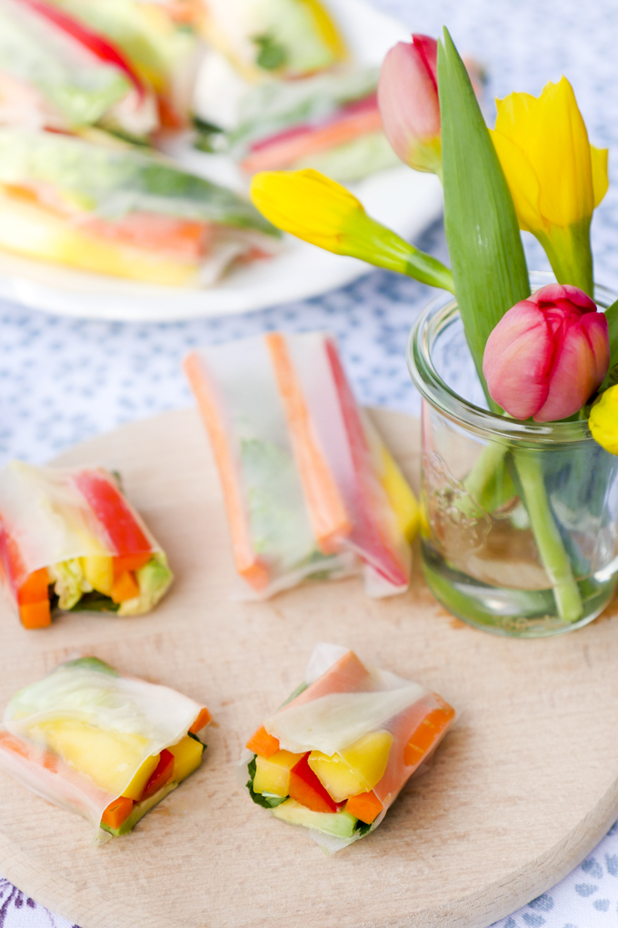 Fast vegetarian summer rolls with mango, avocado, peppers and carrots